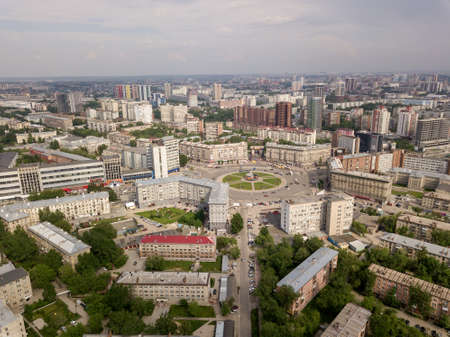 Aerial view of old and new russian buildings near the roundabout in the city with a lot of cars. Russian streets, Novosibirsk.の写真素材