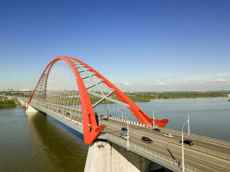 Aerial view of The largest multi-level arch bridge in Russia. Bugrinsky bridge in Novosibirsk and skyline.の写真素材