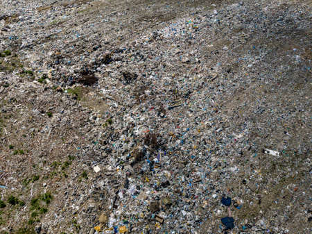 Environmental pollution. Aerial top view photo from flying drone of large garbage pile. Garbage pile in trash dump or landfill.の写真素材