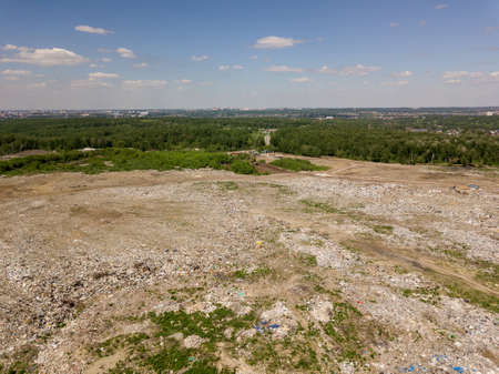 Environmental pollution. Aerial top view photo from flying drone of large garbage pile. Garbage pile in trash dump or landfill.の写真素材