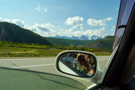 Reflection in the mirror of a photographer