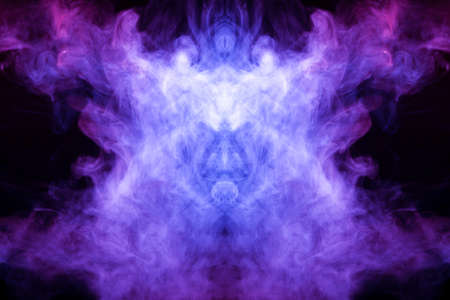 Abstract image of smoke of different colors in the form of horror in the form of the head of the...