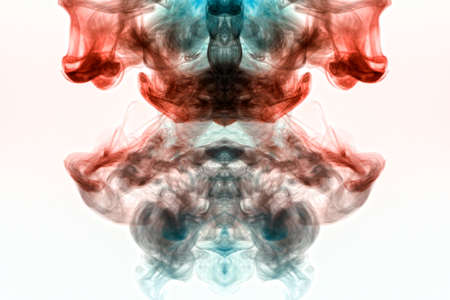 A background of blue, red and green wavy smoke in the shape of a ghost's head or a man of mystical...