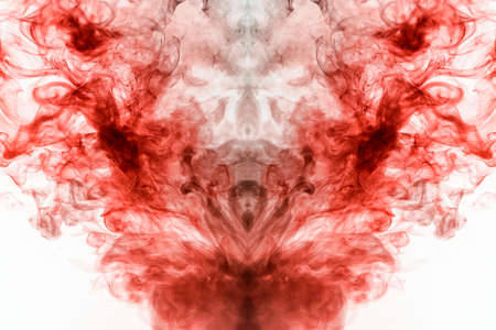 A multi-colored pattern of red smoke of a mystical shape in the form of a face and a ghost's head or...