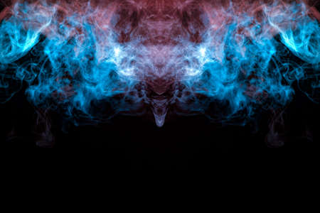 The cosmic dust uniting in a fascinating pattern, interlaced with smooth waves of smoke, exuding vape, shimmering violet, pink, blue color on a dark background.の写真素材