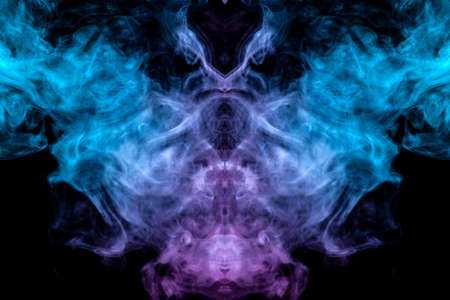 The mystical and mysterious pattern of evaporating blue smoke on a black background is similar in design to an alien head and eyes, rising to the top in pink. T-shirt print.の写真素材