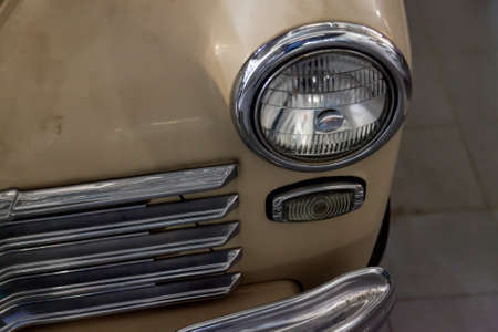 Novosibirsk, Russia - 01.30.19: Russian classic vintage car gaz m20 pobeda part of the history in a repair shop in good condition front headlamp viewのeditorial素材