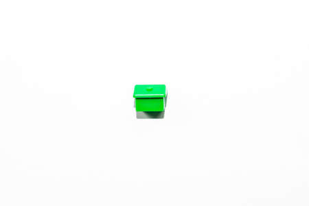 View from the top of the plastic miniature house in green as a part of the game on a white isolated backgroundの写真素材