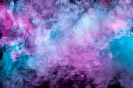 Beautiful pattern of smoke on a black background from the evaporating waves in the neon light of pink blue and purple as sea pebbles in the foam for T-shirt.の写真素材