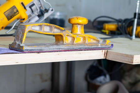 Yellow sandpaper and sandpaper purple color for processing wood and preparing the surface for...