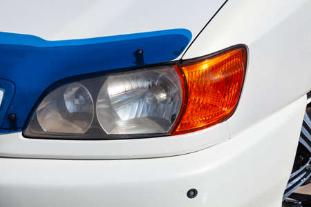 Novosibirsk, Russia - 04.10.2019: Front headlight view of Toyota Ipsum 1998 year in white color...