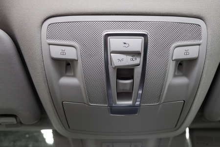 Close-up Interior view with roof light control dashboard and sunroof buttons of luxury very...