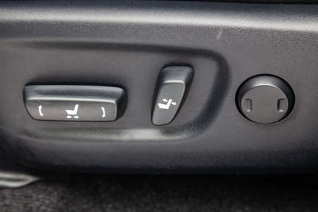 Close-up Interior view with electric seat adjustment,  buttons of luxury very expensive new black...