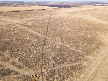 Panorama from the air on the lush meadows and fields with colorful plots of agricultural crops...