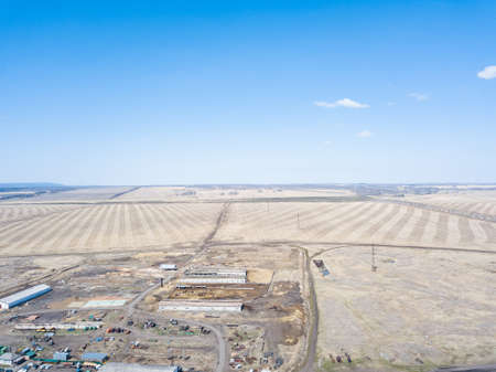 Panorama from the air on the lush meadows and fields with colorful plots of agricultural crops...