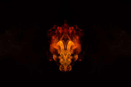 Abstract image of smoke of different green, yellow, orange and red colors in the form of horror in...