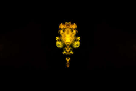 Abstract image of smoke of different green, yellow, orange and red colors in the form of horror in...