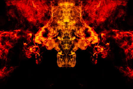 Smoke of different orange and red colors in the form of horror in the shape of the head, face and...