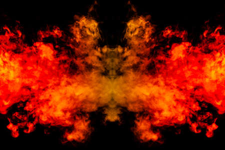 Smoke of different orange and red colors in the form of horror in the shape of the head, face and...