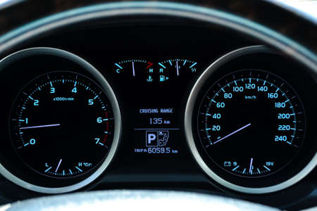 Car dashboard with instruments and dial speedometer tachometer, fuel gauge, engine temperature, oil...