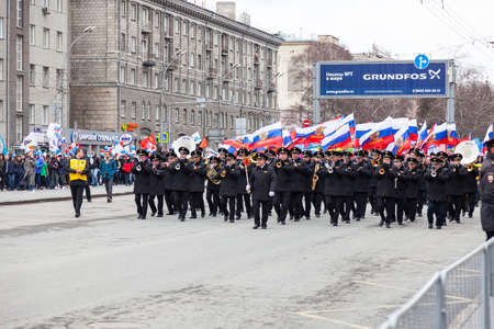 Novosibirsk, Russia - 05.09.2019: A military arcade with a large number of musicians in black full dress with brass instruments and Russian flags during a parade dedicated to the dayのeditorial素材