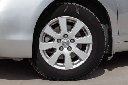 Novosibirsk, Russia - 07.09.2019: Front wheel view of Toyota Camry 2006 in silver color after...