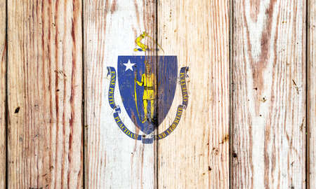 Alabama US state national flag on a gray wooden boards background on the day of independence in different colors of blue red and yellow. Political and religious disputes, customs and delivery.の写真素材