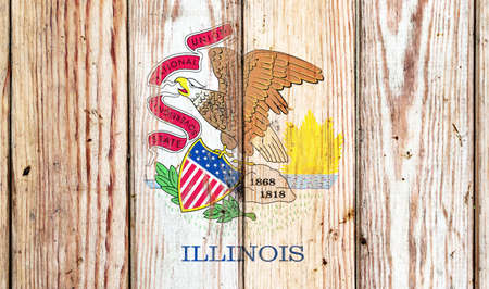 Illinois US state national flag on a gray wooden boards background on the day of independence in different colors of blue red and yellow. Political and religious disputes, customs and delivery.の写真素材