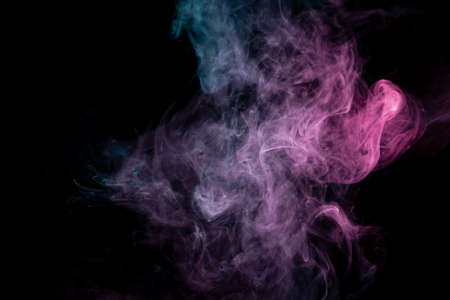 Colored background with winding clouds of smoke from patterns of different forms of pink, green and blue colors with tongues of flame on a black isolated background. Print for t-shirt.の写真素材