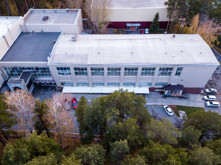 Novosibirsck, Russia - 01.01.2013: Aerial View of one entrance to bulding with offices and parking...