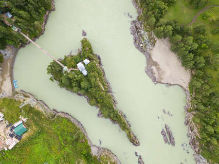 Aerial view of a landmark in the Altai Territory Patmos Island with a monastery church and a suspended wooden bridge.の写真素材
