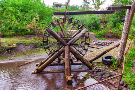 Old retro water mill for generating electricity from natural sources without pollution. Hydro Power...