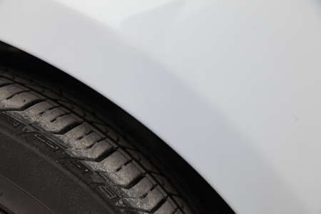 Background of the automotive part near the wheel with a view of the tread and tire of the vehicle.の写真素材