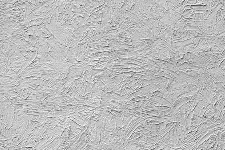 Background with texture of wavy gray paint on the wall.