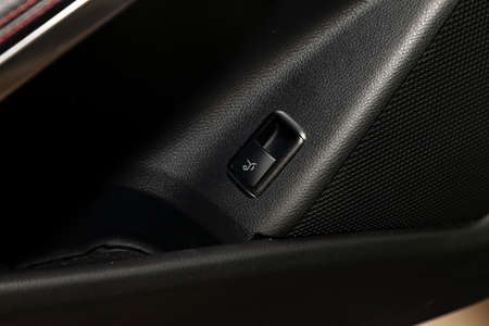 Interior view with electric trunk adjustment button of luxury very expensive new beige car after...