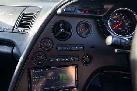 Novosibirsk, Russia - 10.09.2019: Interior of a rare Japanese sports car in the back of a gray Toyota Supra coupe with a dashboard, audio system, panel cockpit and carbon trimのeditorial素材