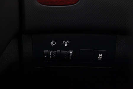 Black button for turning on and off the electronic system of vehicle stability control with a white...
