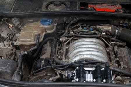 Hood space used car in a workshop for the repair and maintenance of vehicles during engine overhaul....