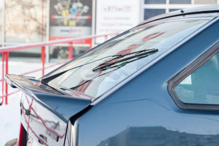 Novosibirsk, Russia - 12.27.2019: Green lada 2114 year front view with dark gray interior in excellent condition in a parking space among other carsの写真素材