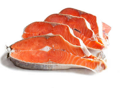 Delicious steaks of coho salmon fish after freezing before cooking in a restaurant or kitchen....
