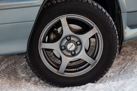Novosibirsk, Russia - 02.01.2020: Gray lada 2114 front wheel view with dark gray interior in...