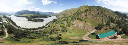 Aerial view of a picturesque place in the Altai mountains with a cross-country trail along the Katun river.の写真素材