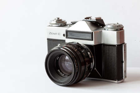 Novosibirsk, Russia - 02.15.2020: Old retro Soviet Zenith Zenit E camera with exposure meter on a white isolated backgroundのeditorial素材