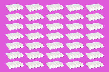 Abstract pop art style image of several rows of packs of a dozen white shell eggs on a purple...