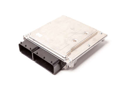 Plastic car engine control unit with metal elements on a white isolated background - the connecting center of different subsystems, nodes and aggregates.の写真素材