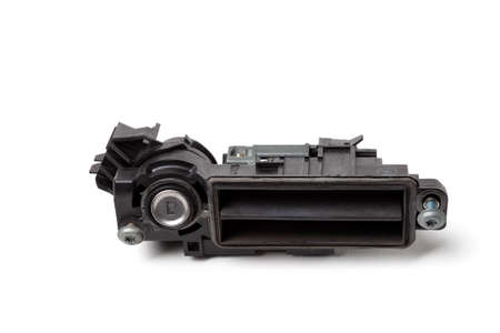 Detail of a car spare part made of black plastic and metal - handle for opening the trunk...
