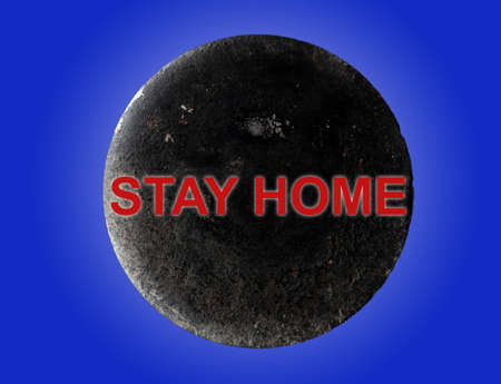 The inscription in red STAY HOME over the planet Moon on a blue background. The concept of lockdown...
