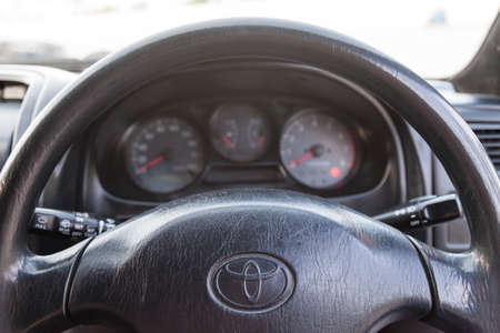 Novosibirsk, Russia - 11.06.20: Interior of Toyota Caldina car of 2000 release in the back of a silver T210 station wagon with steering wheel and dashboard in a parking lot.のeditorial素材