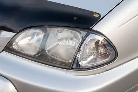 Novosibirsk, Russia - 11.06.20: Front headlight view of Toyota Caldina car of 2000 release in the...
