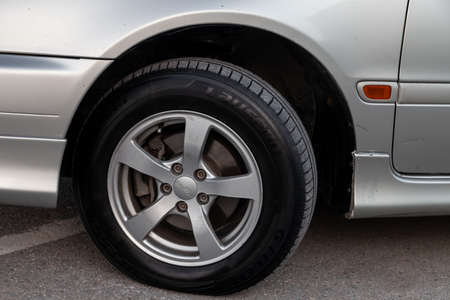 Novosibirsk, Russia - 11.06.20: Front wheel view Toyota Caldina car of 2000 release in the back of a...